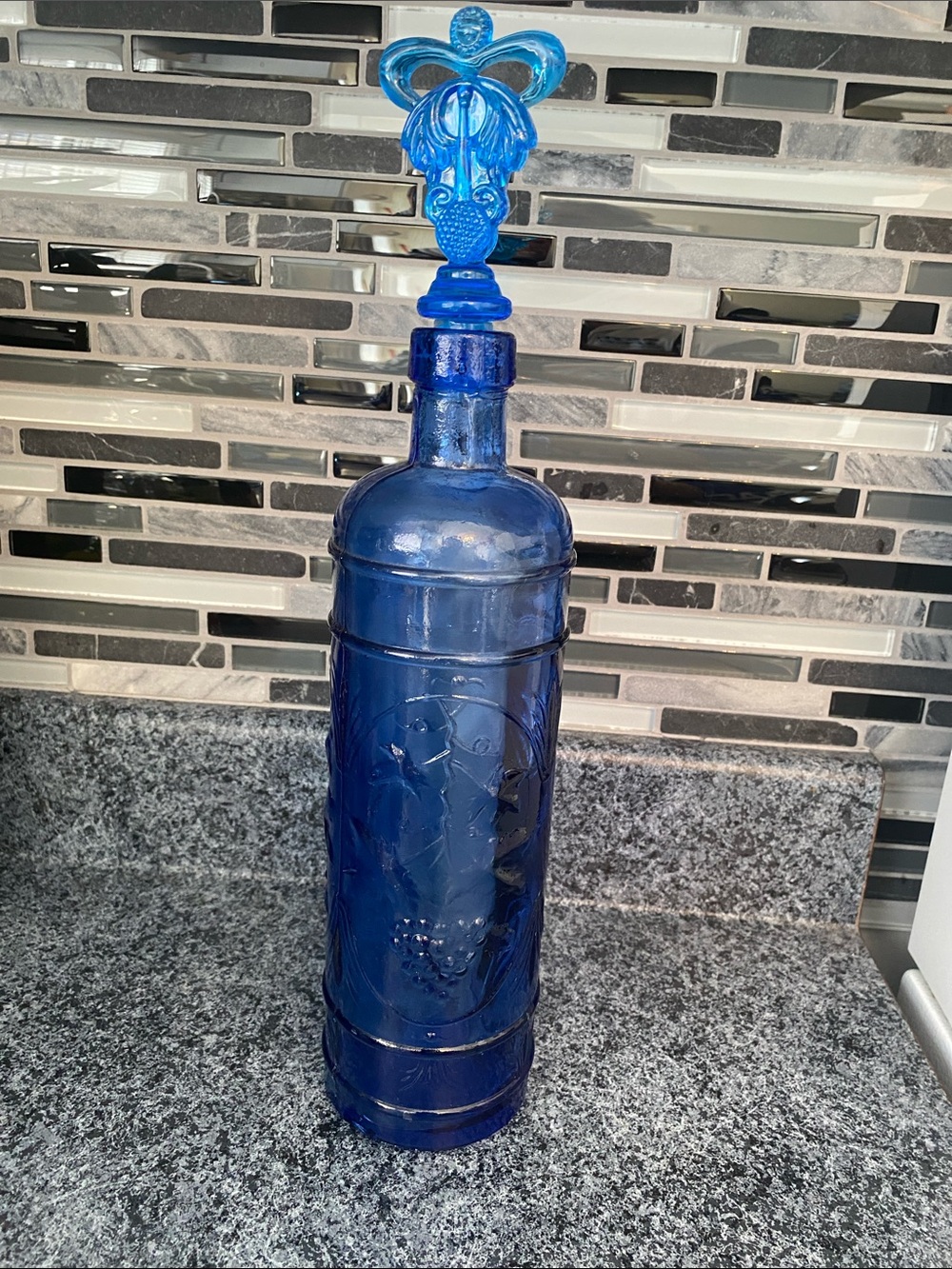 Vintage Cobalt blue glass Bottle 14” overall high.
